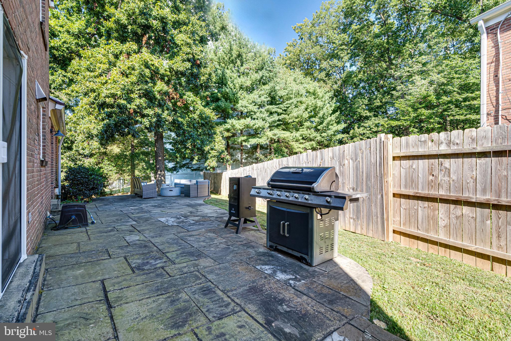 8501 Aqueduct Road Potomac, MD 20854 - Photo 65 of 75 a view of a backyard with chairs