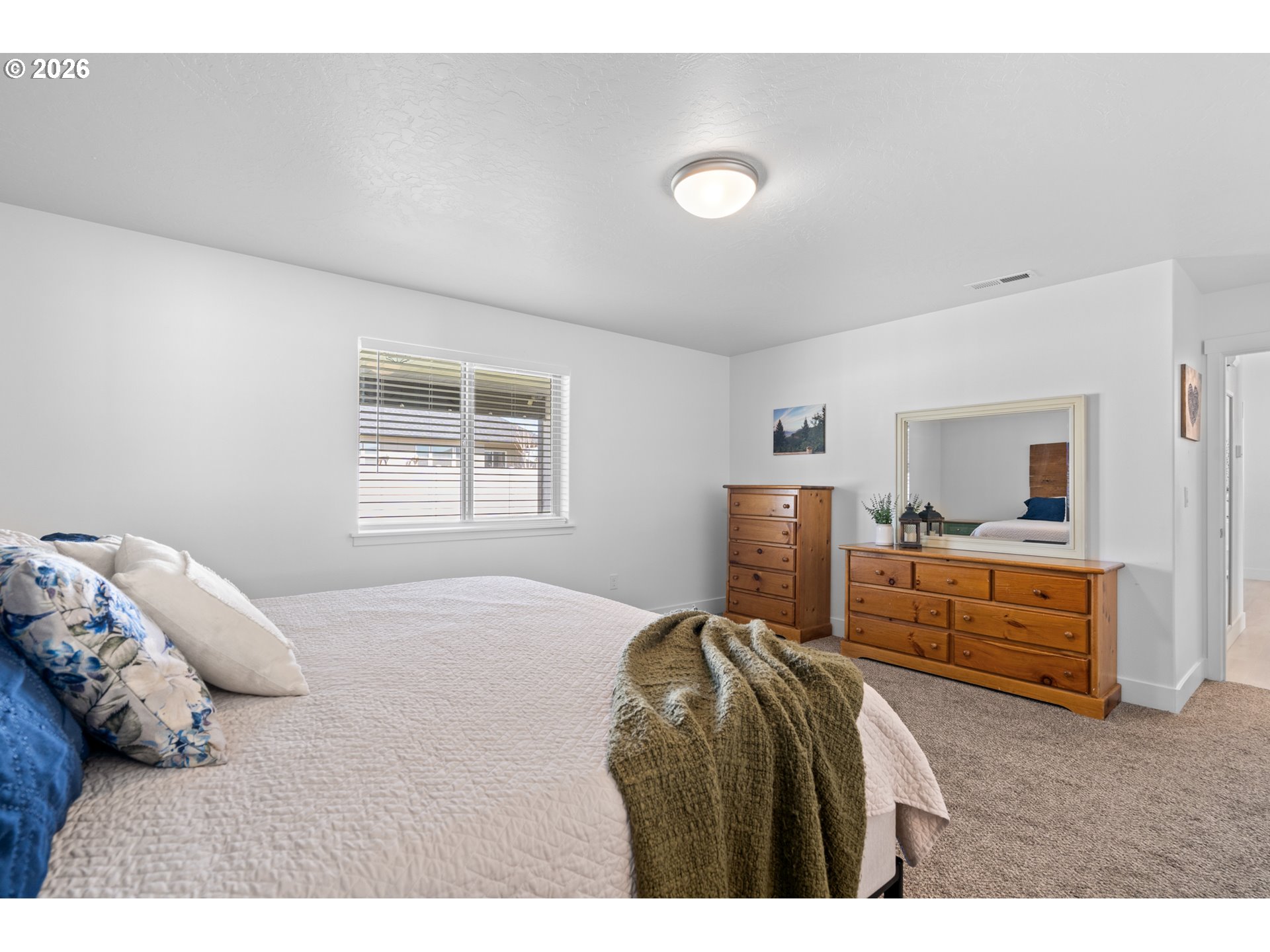 306 Sage Street Boardman, OR 97818 - Photo 11 of 24 a bedroom with a bed and a dresser