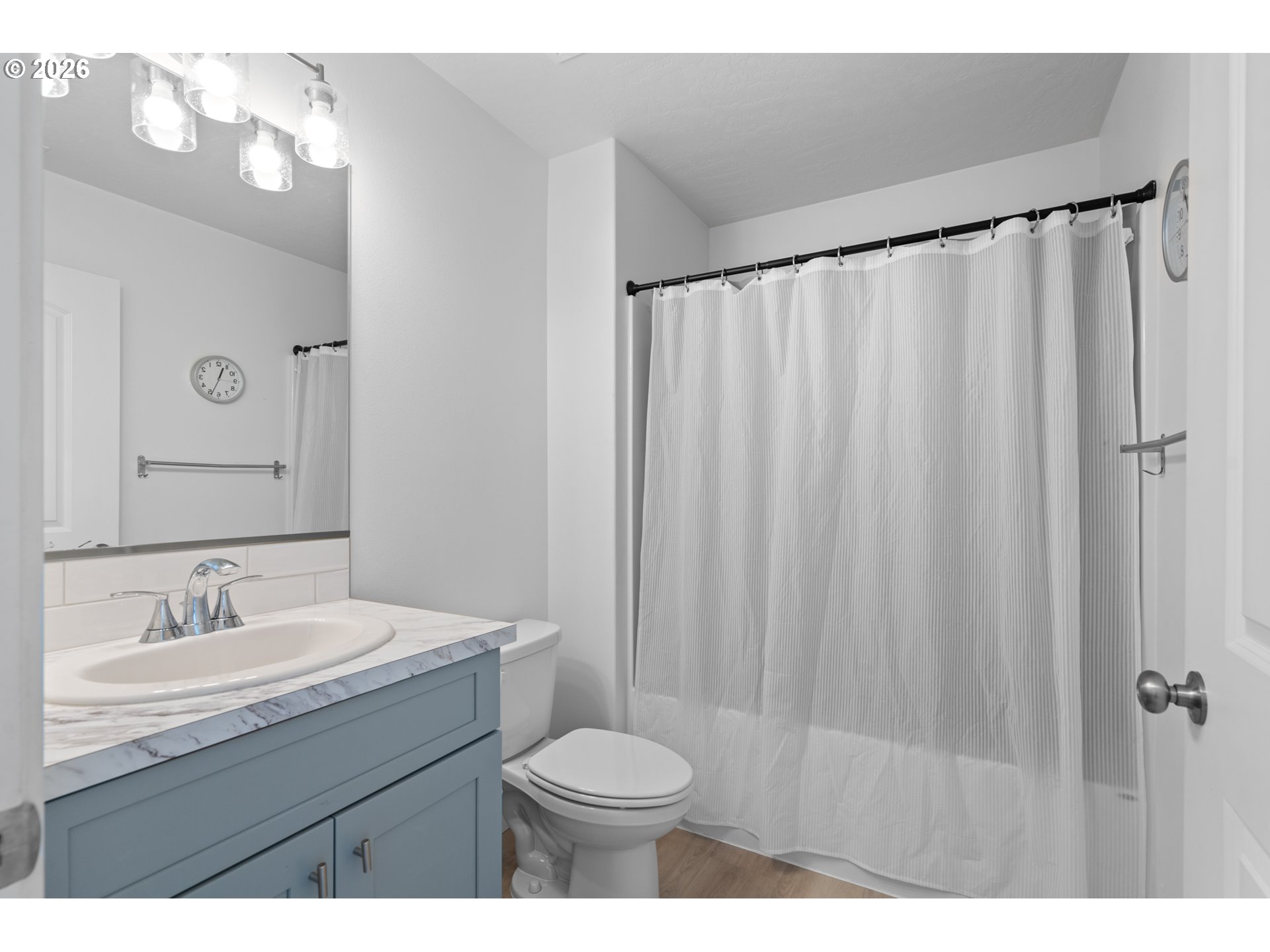 306 Sage Street Boardman, OR 97818 - Photo 15 of 24 a bathroom with a sink a toilet a mirror and shower