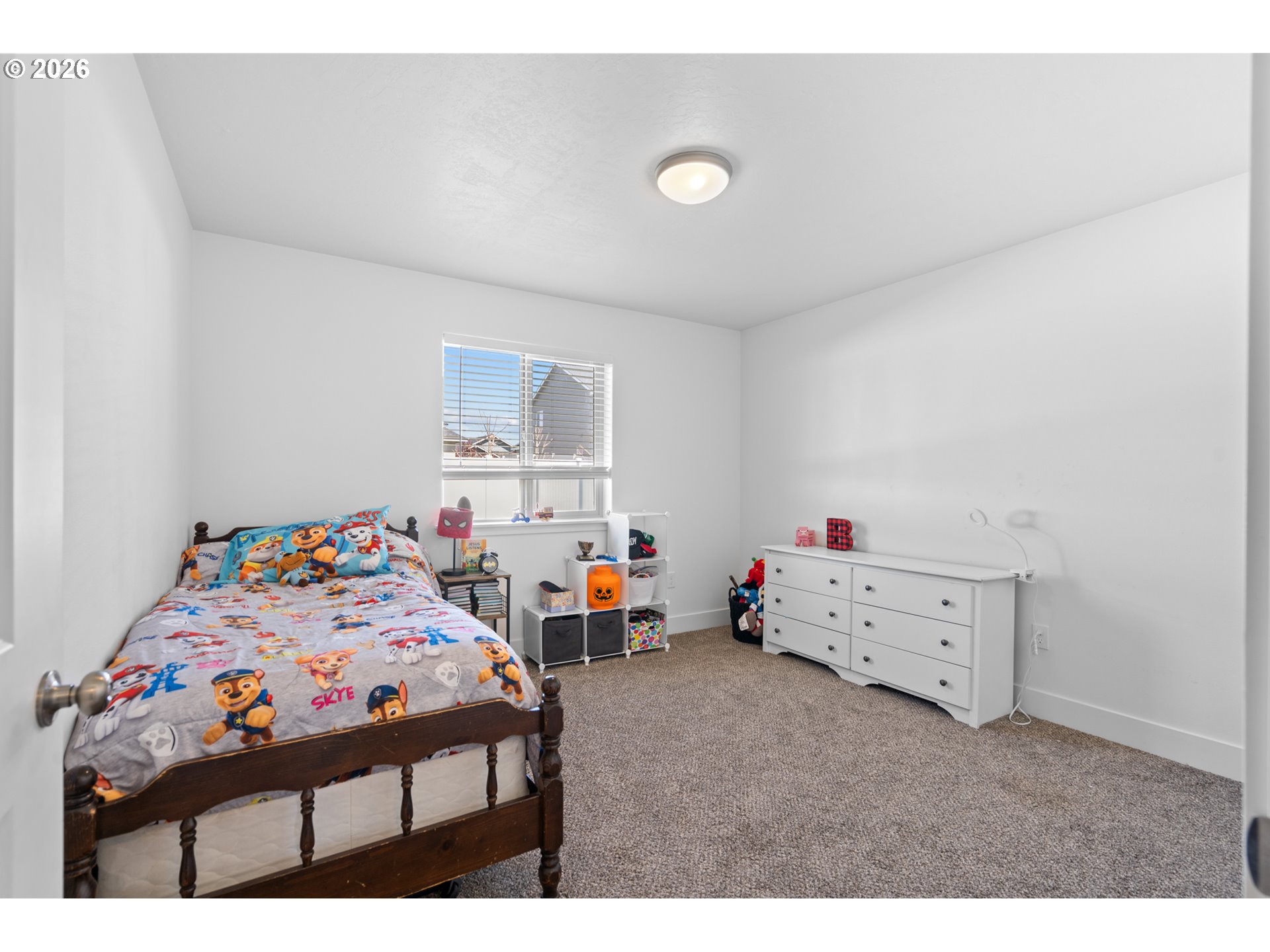 306 Sage Street Boardman, OR 97818 - Photo 16 of 24 a children room with toys and a bed