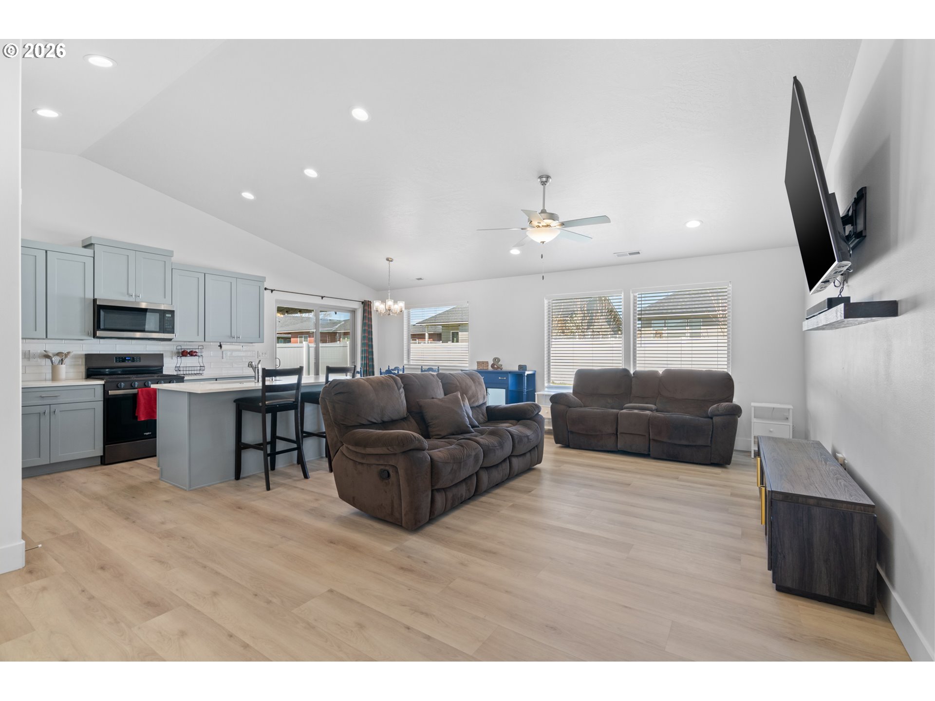 306 Sage Street Boardman, OR 97818 - Photo 2 of 24 a living room with furniture and a flat screen tv