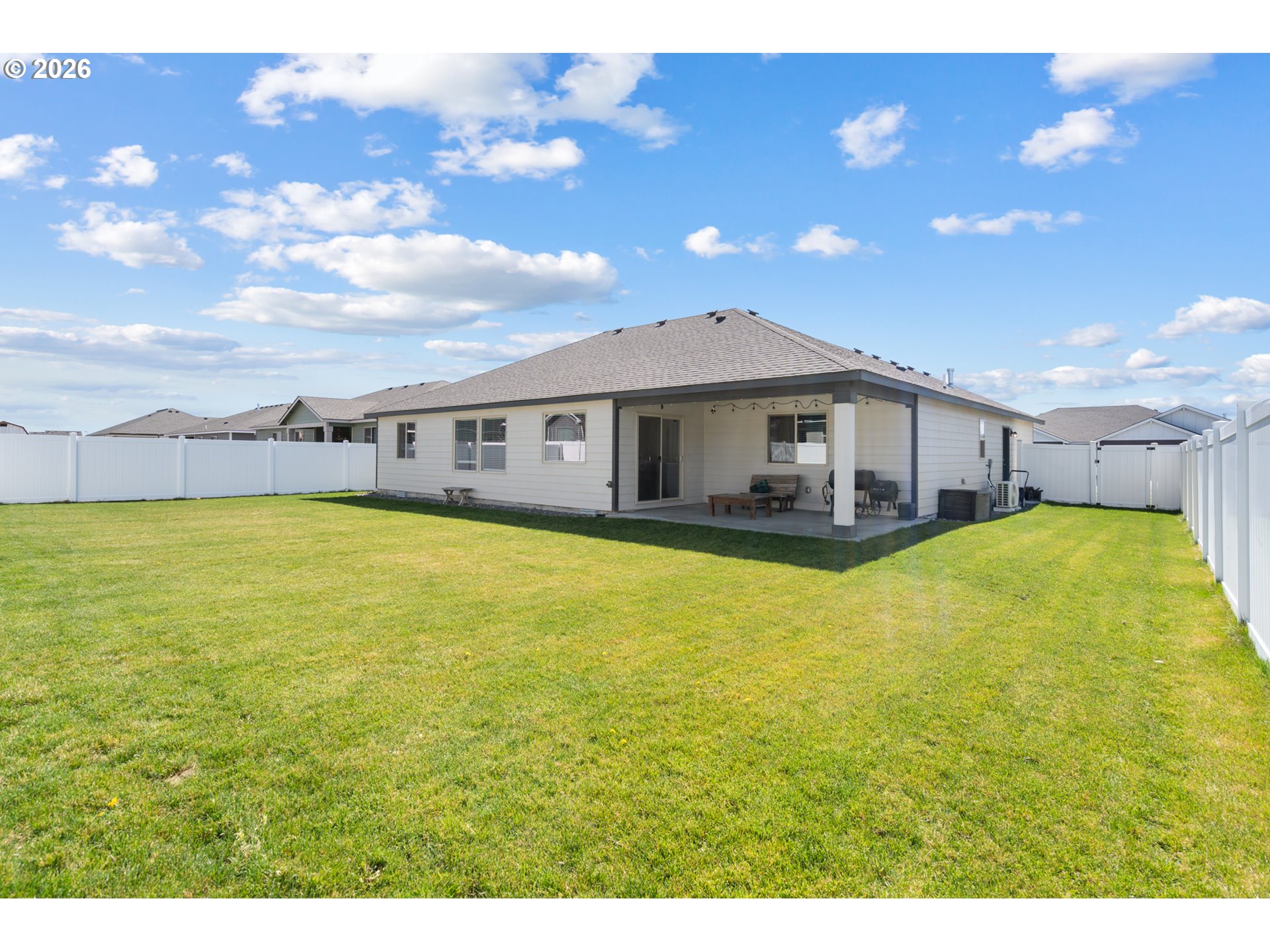 306 Sage Street Boardman, OR 97818 - Photo 21 of 24 a view of a house with a swimming pool