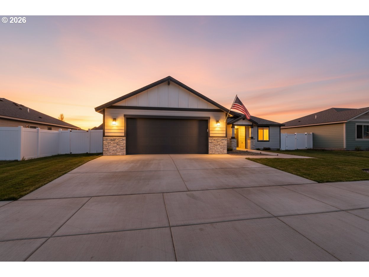 306 Sage Street Boardman, OR 97818 - Photo 24 of 24 a front view of a house with a yard and garage