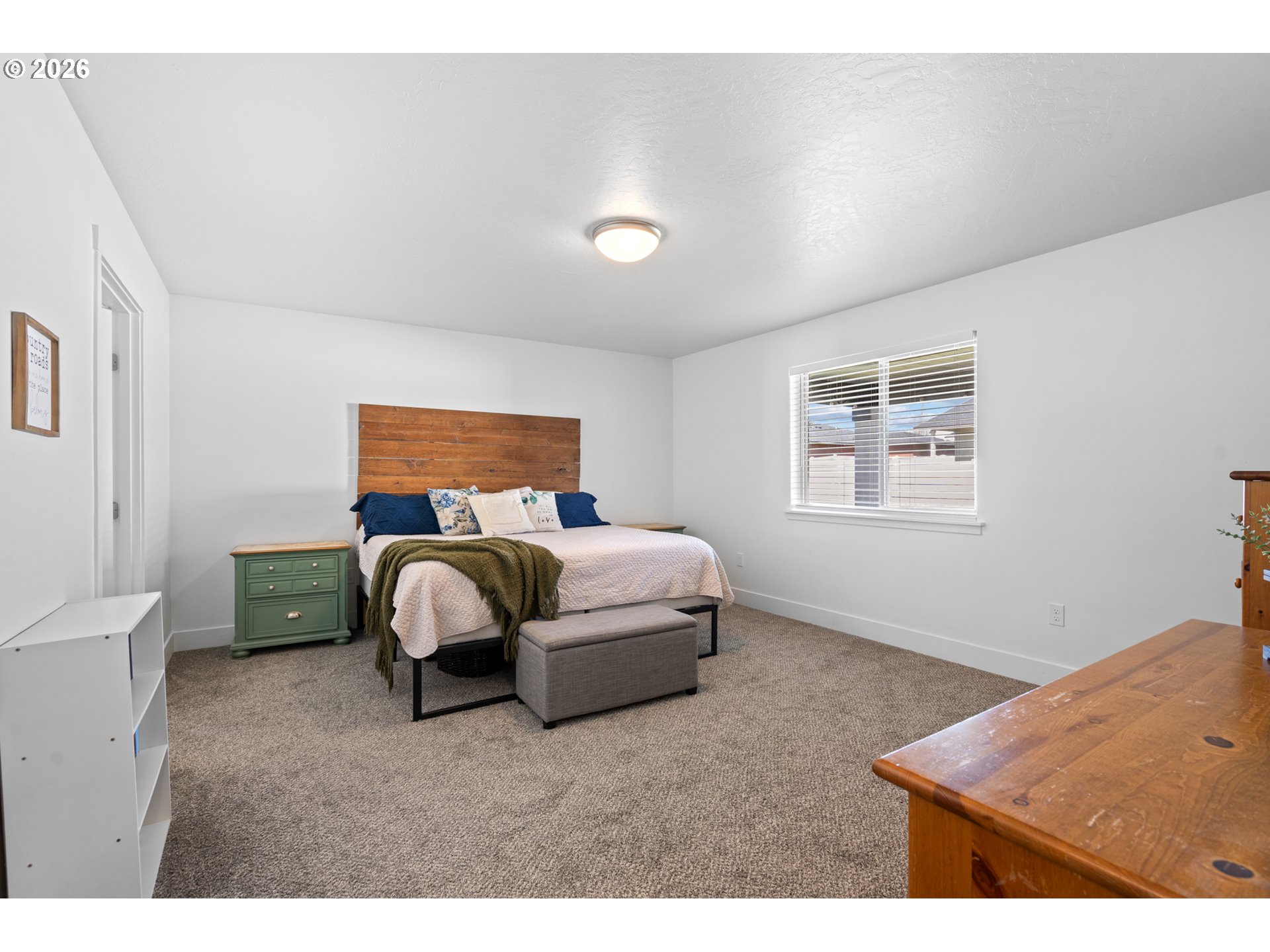 306 Sage Street Boardman, OR 97818 - Photo 7 of 24 a bedroom with a bed and a window