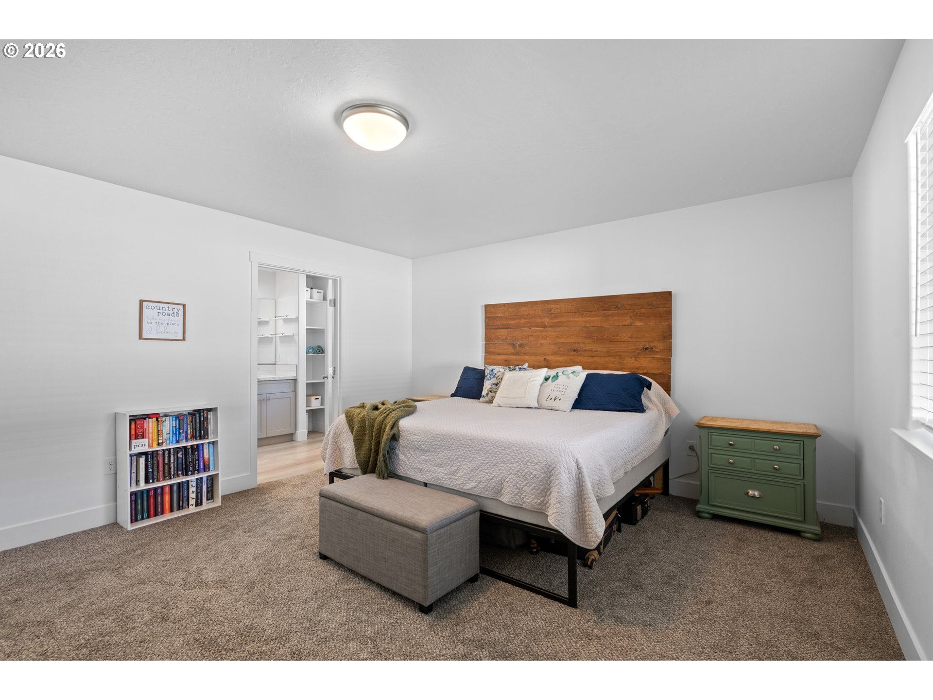 306 Sage Street Boardman, OR 97818 - Photo 8 of 24 a bedroom with a bed and a book shelf