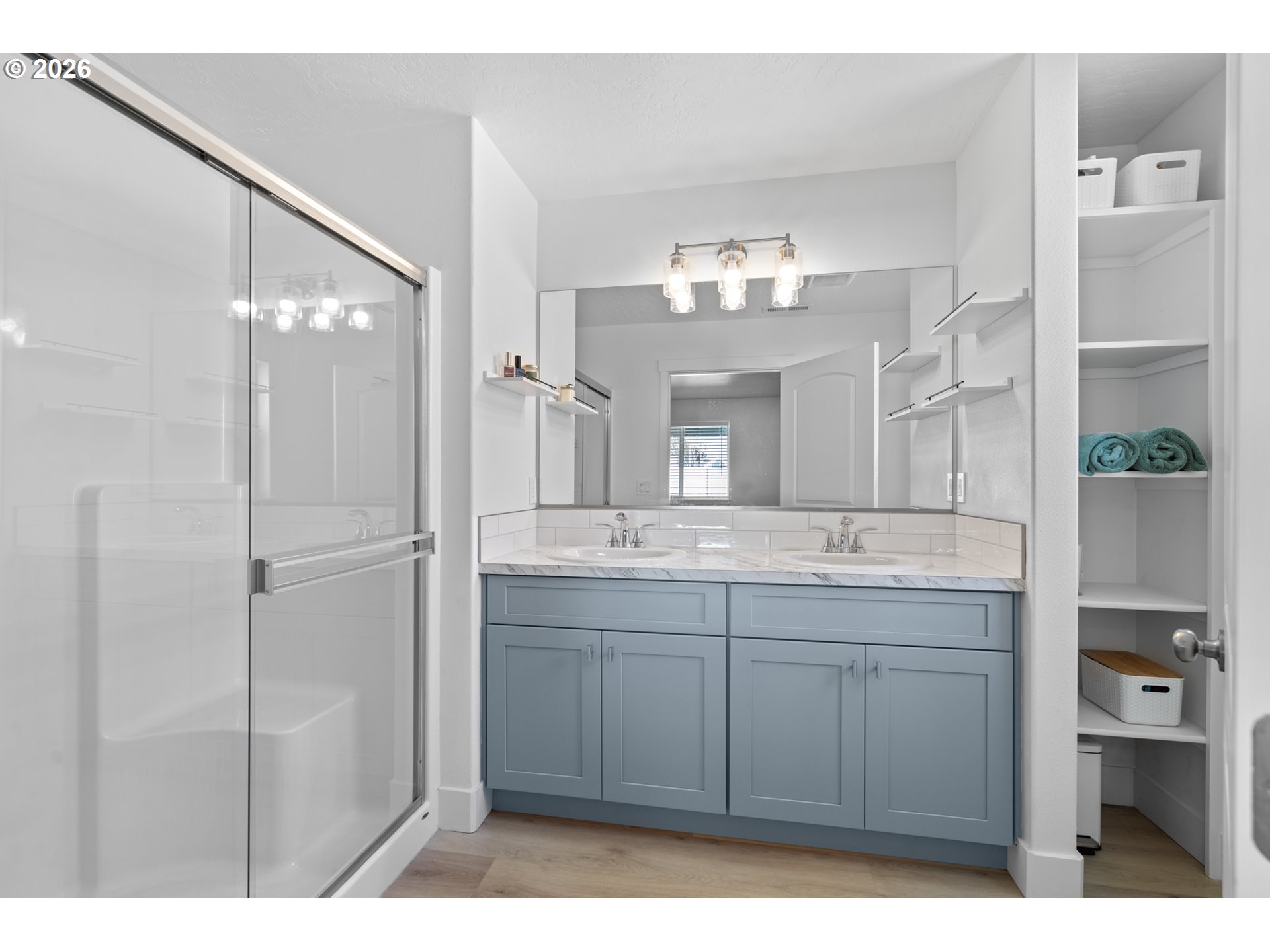 306 Sage Street Boardman, OR 97818 - Photo 9 of 24 a bathroom with a double vanity sink and mirror