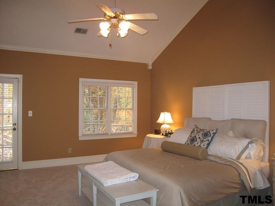 2812 Hawtree Drive Raleigh, NC 27613 - Photo 11 of 22 a bedroom with a bed and a window
