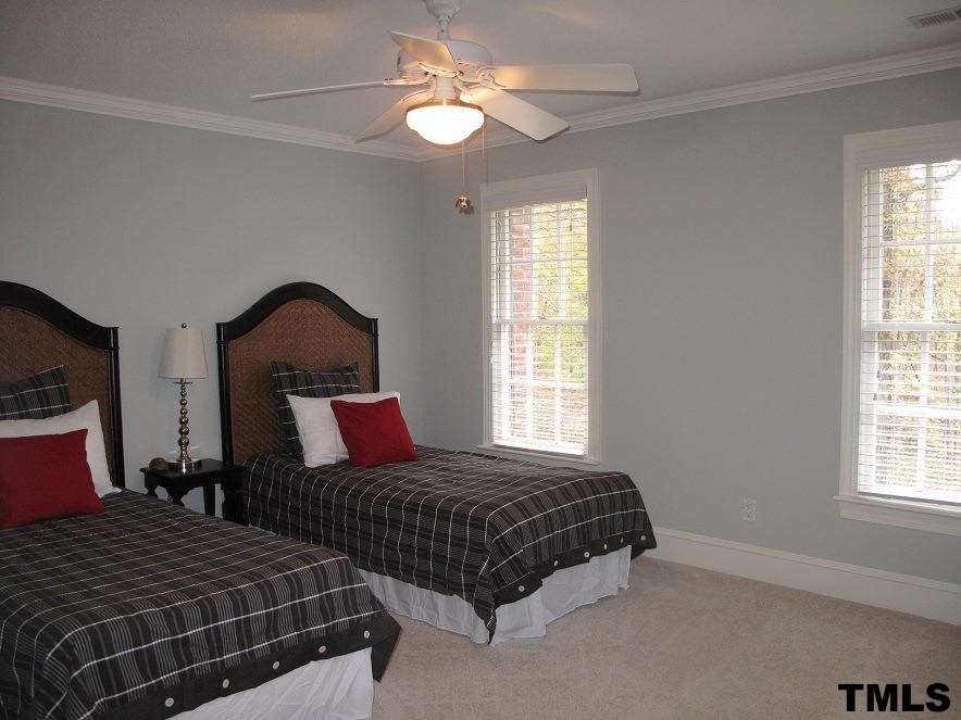 2812 Hawtree Drive Raleigh, NC 27613 - Photo 16 of 22 a bedroom with bed and window