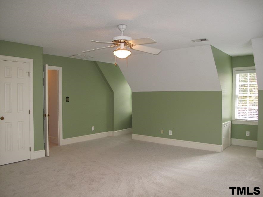 2812 Hawtree Drive Raleigh, NC 27613 - Photo 19 of 22 a view of empty room with window and ceiling fan