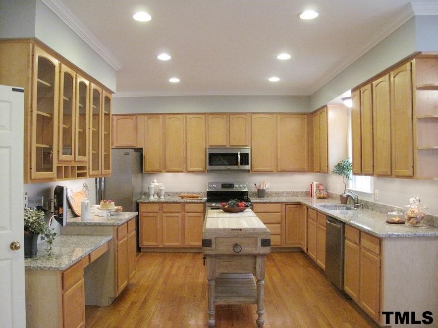 2812 Hawtree Drive Raleigh, NC 27613 - Photo 8 of 22 a kitchen with a sink stove top oven and refrigerator