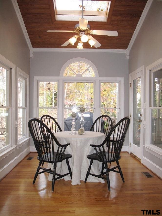 2812 Hawtree Drive Raleigh, NC 27613 - Photo 10 of 22 a view of a dining room with furniture window and wooden floor