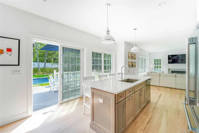 a kitchen with granite countertop a stove and a sink