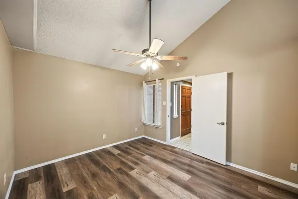 a view of a room with a ceiling fan