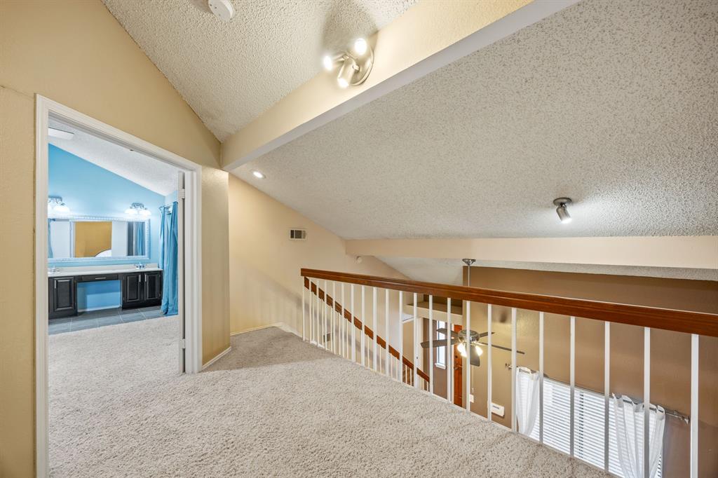 559 Ranch Trail, Unit 213 Irving, TX 75063 - Photo 15 of 18 a view of hallway with stairs