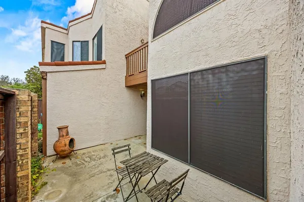 a view of a house with garage and a car parked in it