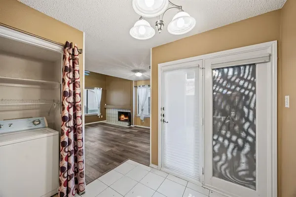 a view of an entryway with wooden floor