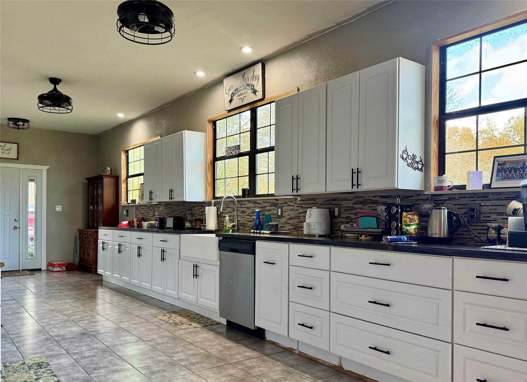 307 Deerwood Drive Trinity, TX 75862 - Photo 5 of 27 One of the things I love about about this house is the openness. EVERYTHING DOWN is GIGANTIC. The kitten is wide open. The dining room could feed a kings court!