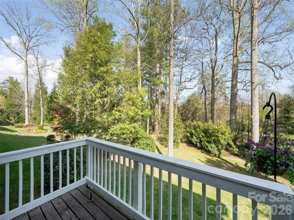 a view of a balcony with wooden fence