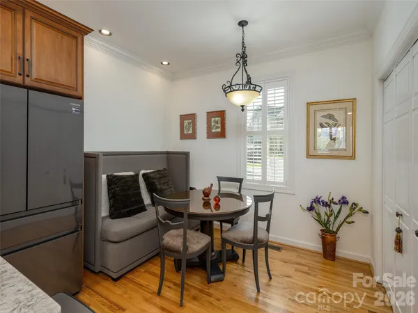 a dining room with furniture and window