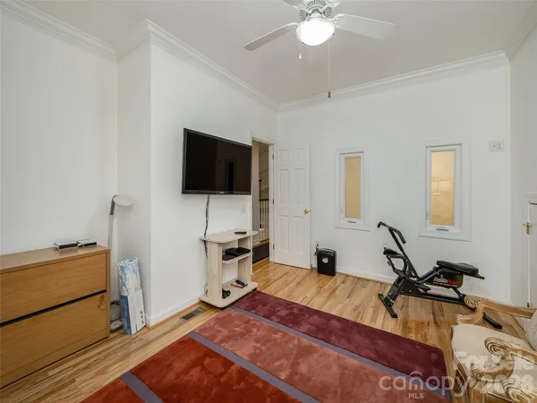 a view of a livingroom with furniture and a flat screen tv