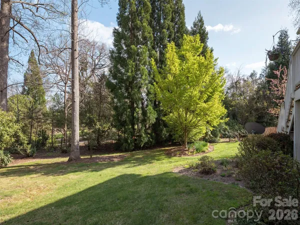 a view of outdoor space with deck and yard