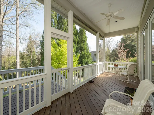 a view of a balcony with wooden floor
