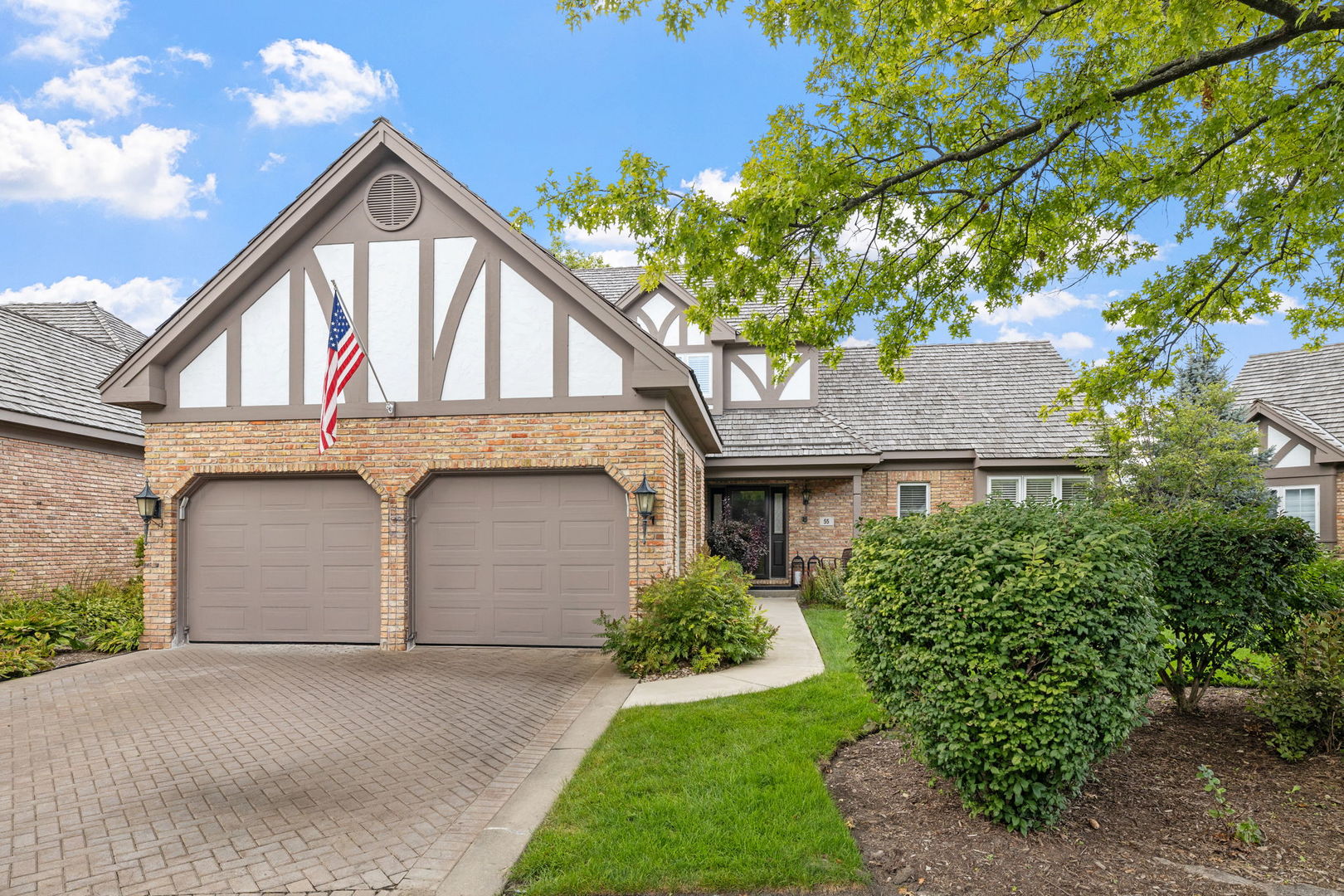 55 Chesterfield Court Burr Ridge, IL 60527 - Photo 1 of 34 a front view of a house with a yard and garage