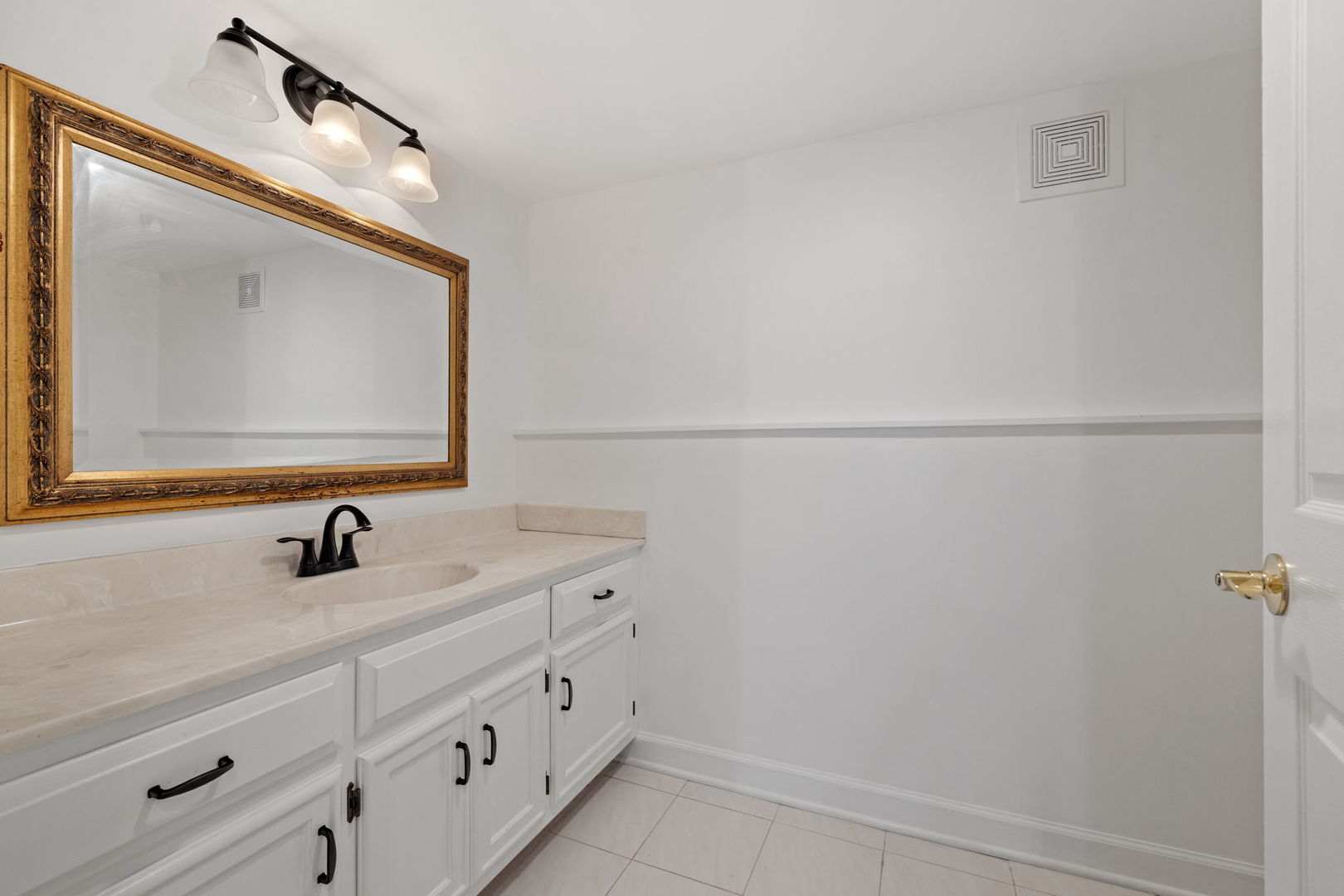 55 Chesterfield Court Burr Ridge, IL 60527 - Photo 27 of 34 a bathroom with a sink and a mirror