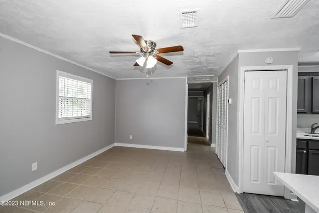 a view of an empty room with a window