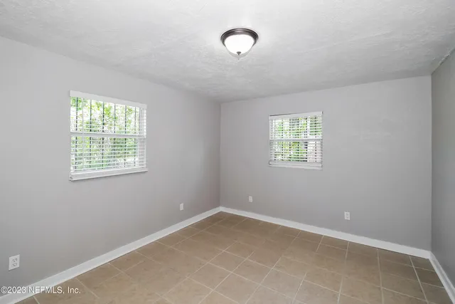 an empty room with windows