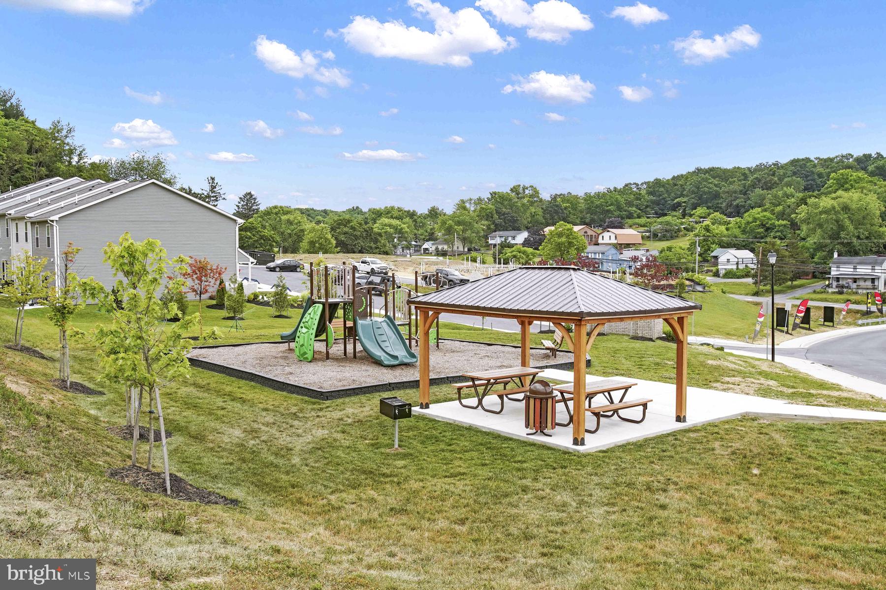 30 Cramsford Street Falling Waters, WV 25419 - Photo 11 of 11 a view of a swimming pool with lawn chairs under an umbrella