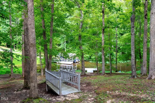 a view of a wooden deck and a yard