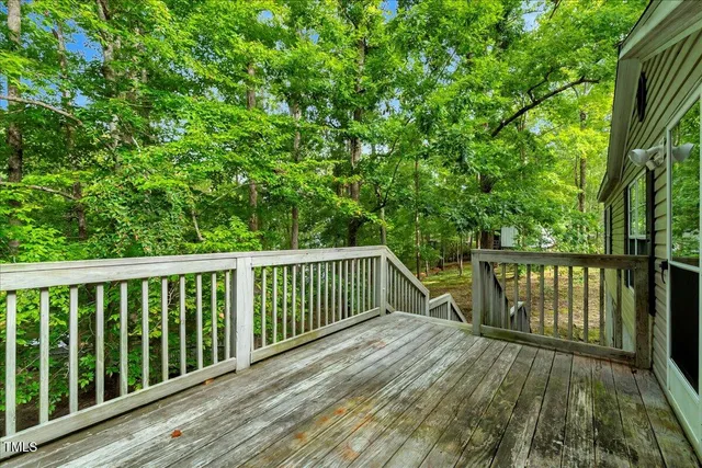 a view of balcony with wooden floor