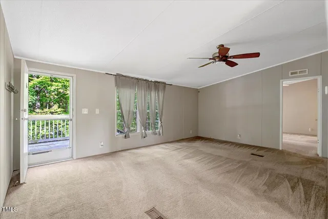 a view of an empty room with a window