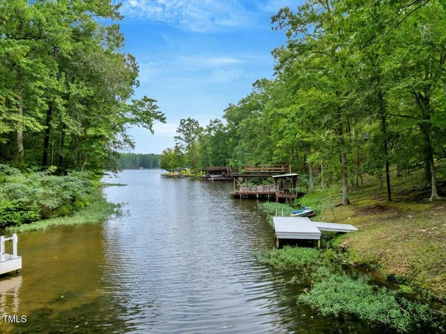 a view of a wooden deck with lake