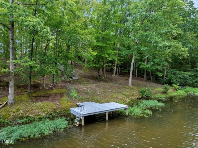 a view of a backyard with swimming pool