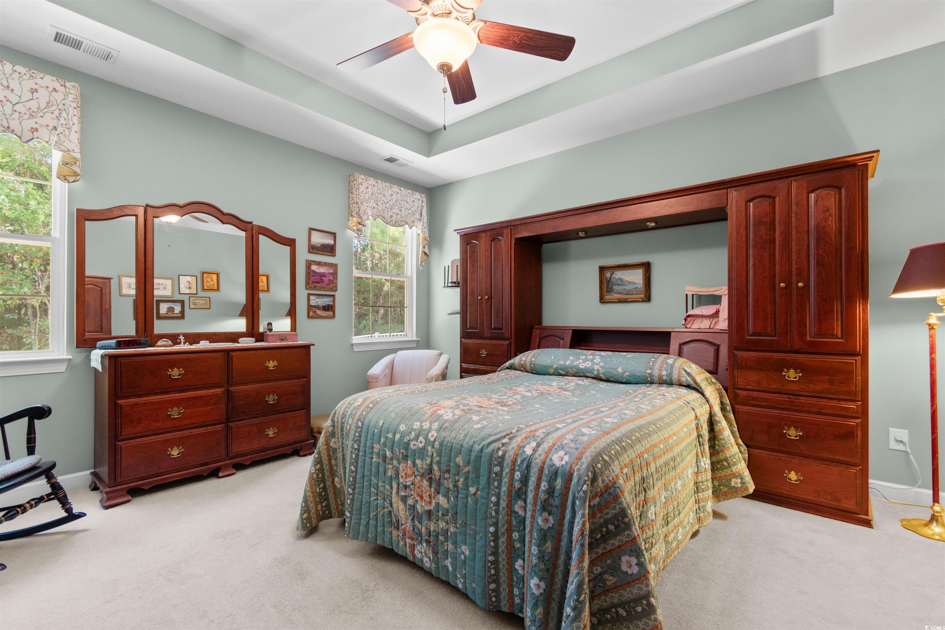 1573 Culbertson Avenue Myrtle Beach, SC 29577 - Photo 14 of 40 Bedroom with light colored carpet, a raised ceiling, and a ceiling fan
