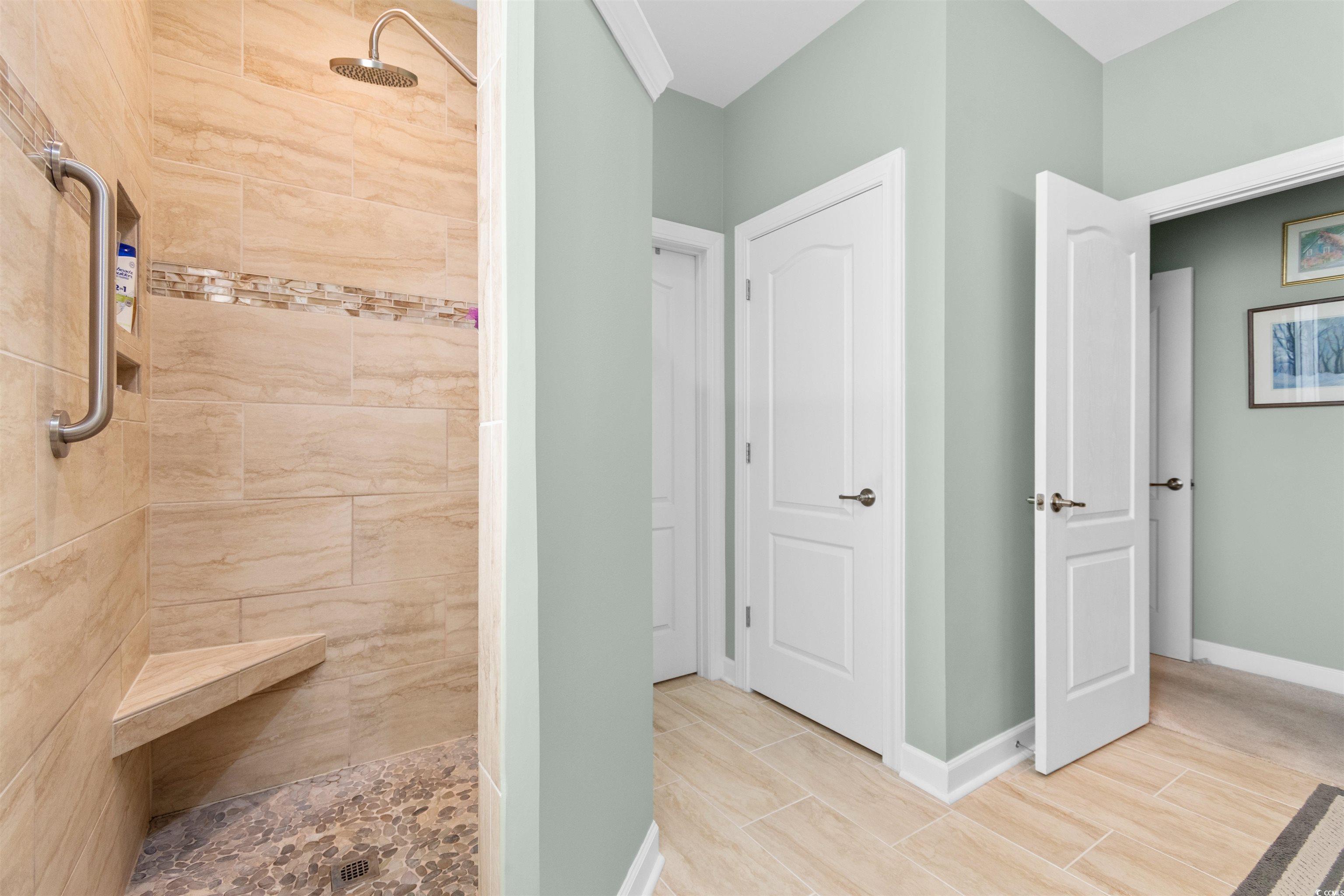 1573 Culbertson Avenue Myrtle Beach, SC 29577 - Photo 16 of 40 Bathroom featuring a tile shower and wood finish floors