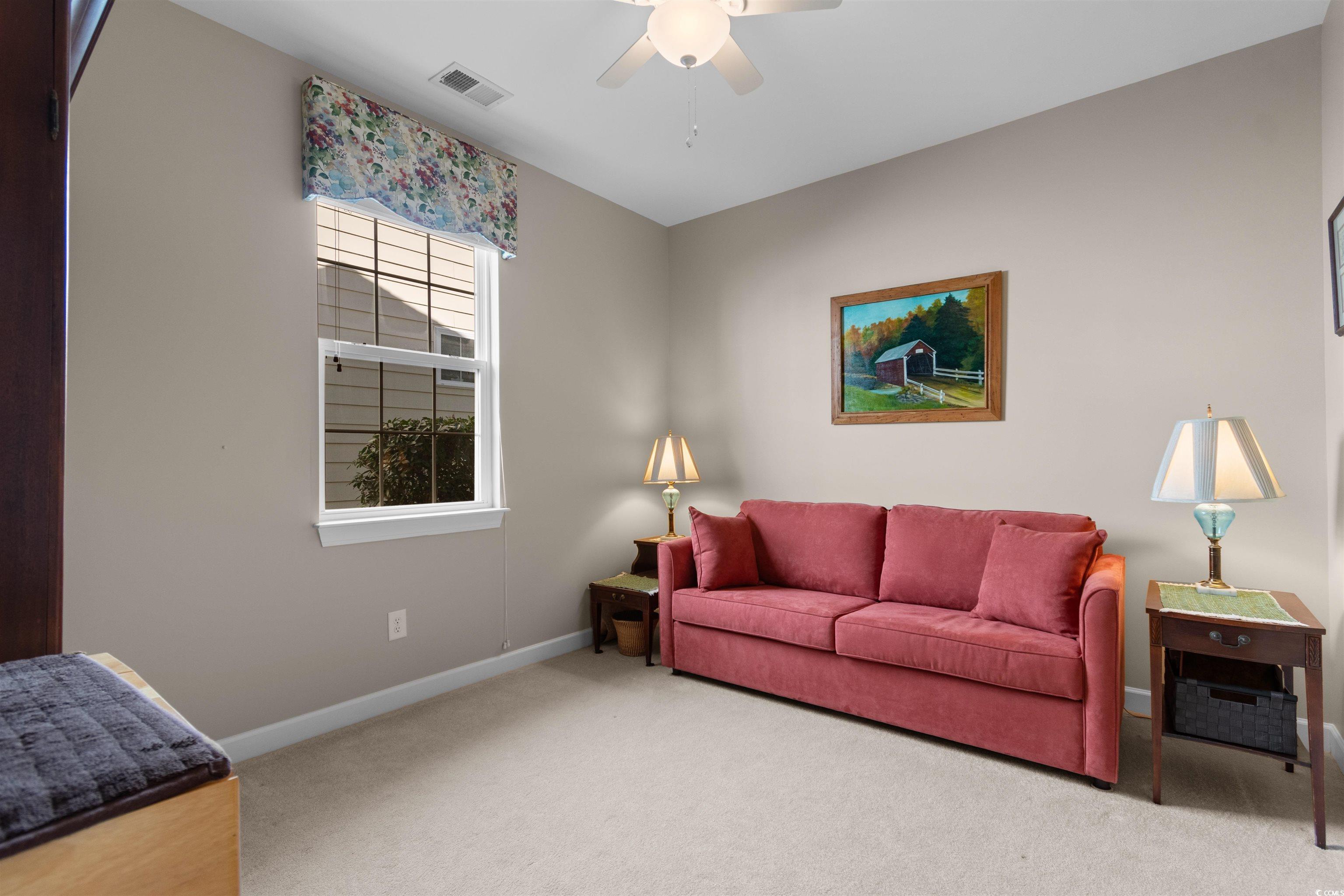 1573 Culbertson Avenue Myrtle Beach, SC 29577 - Photo 18 of 40 Living room with carpet flooring and ceiling fan