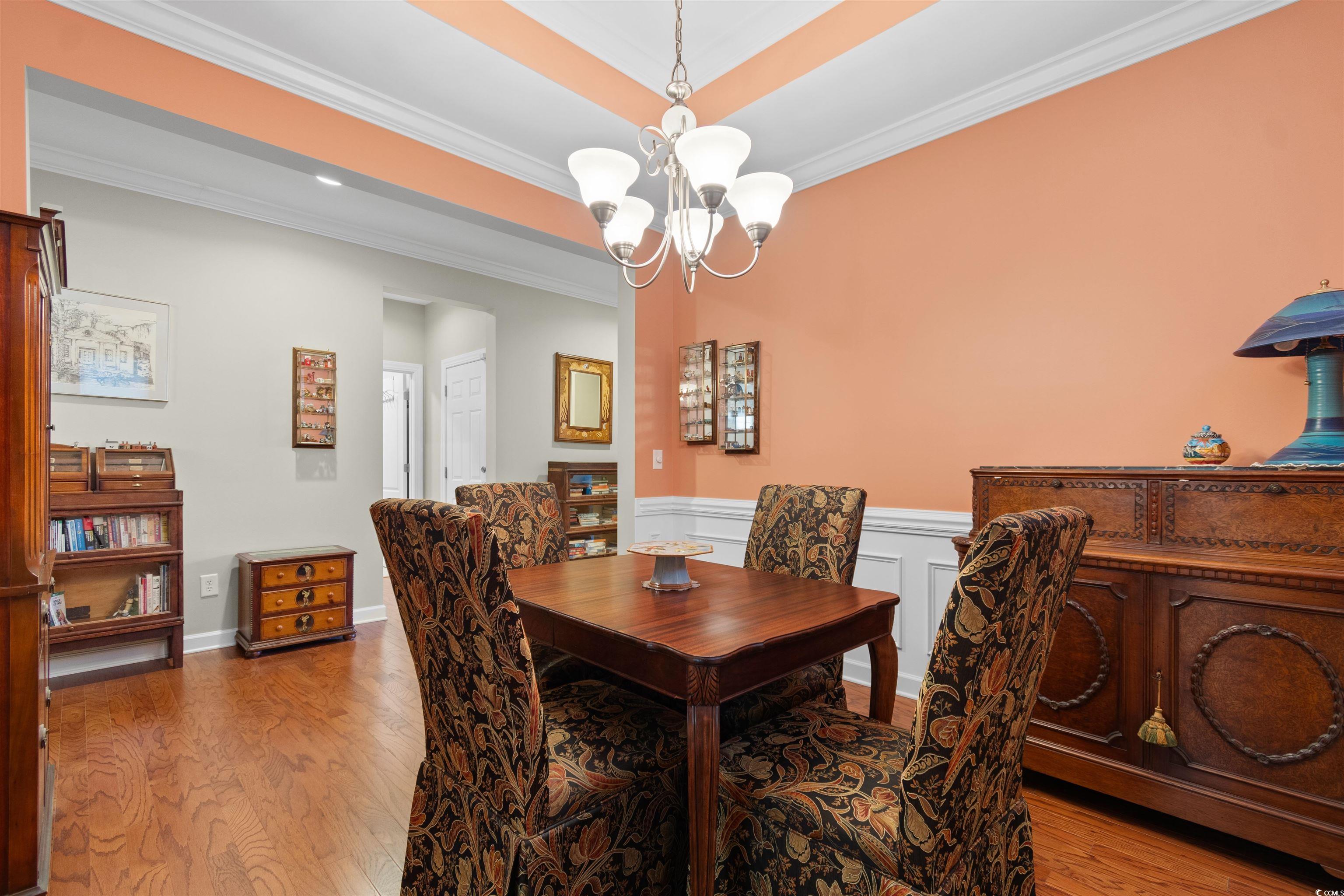 1573 Culbertson Avenue Myrtle Beach, SC 29577 - Photo 20 of 40 Dining room with ornamental molding, wood finished floors, and a chandelier