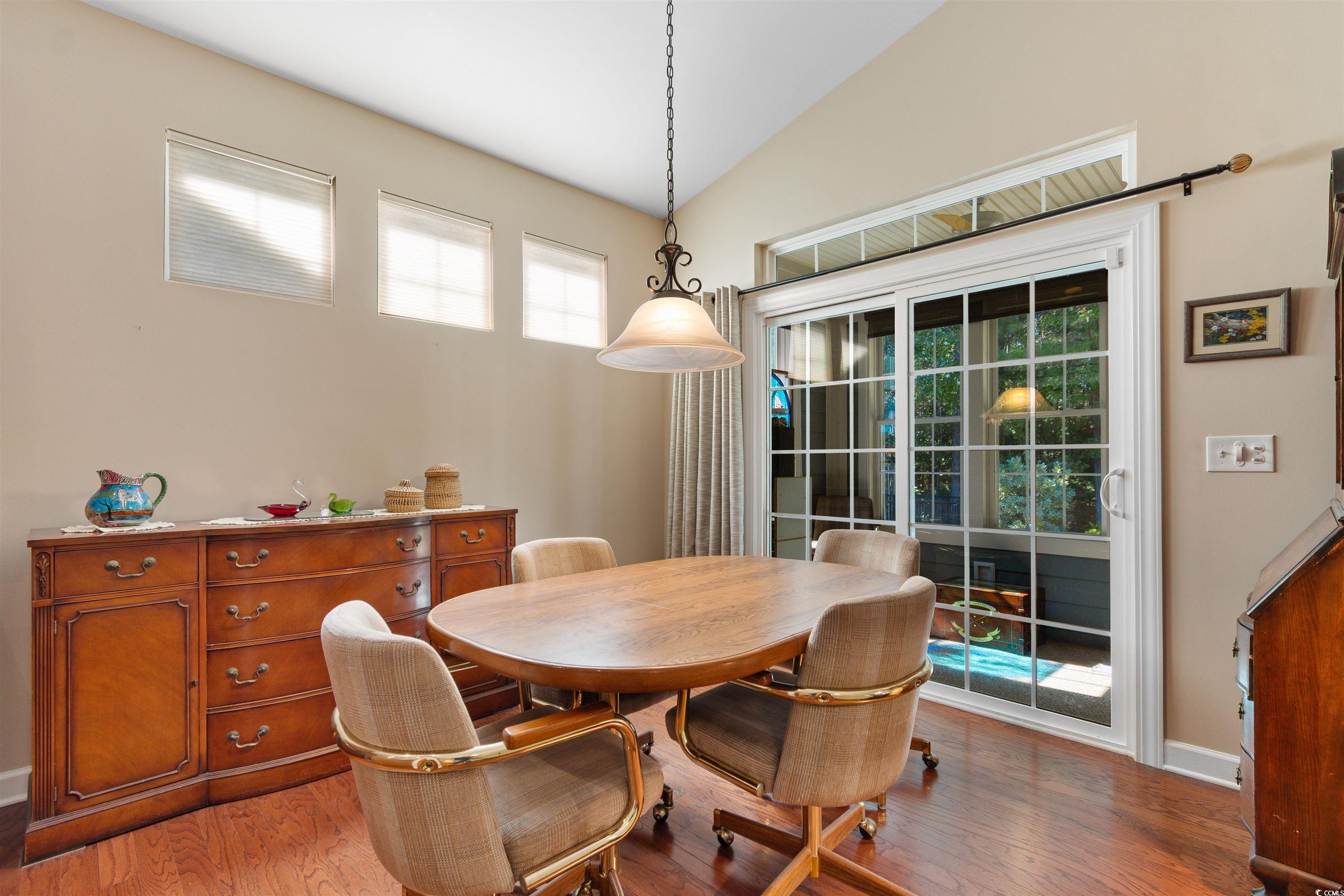 1573 Culbertson Avenue Myrtle Beach, SC 29577 - Photo 8 of 40 Dining room featuring vaulted ceiling and light wood-style floors