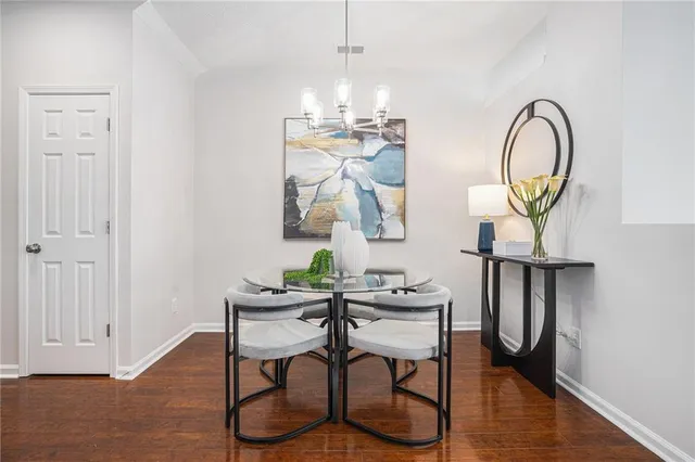 a view of dining room with furniture and wooden floor