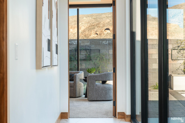 3607 South Cypress Pt Road Hurricane, UT 84737 - Photo 31 of 59 Hallway to primary bedroom featuring plenty of natural light from the sliders to the pool area.