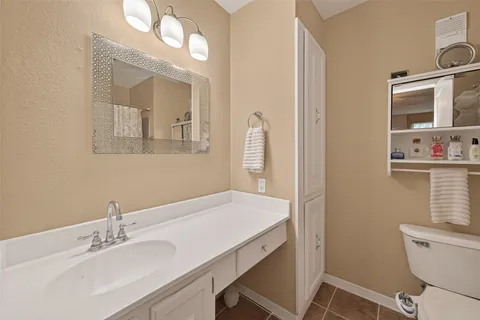 a bed room with a bed and a night stand