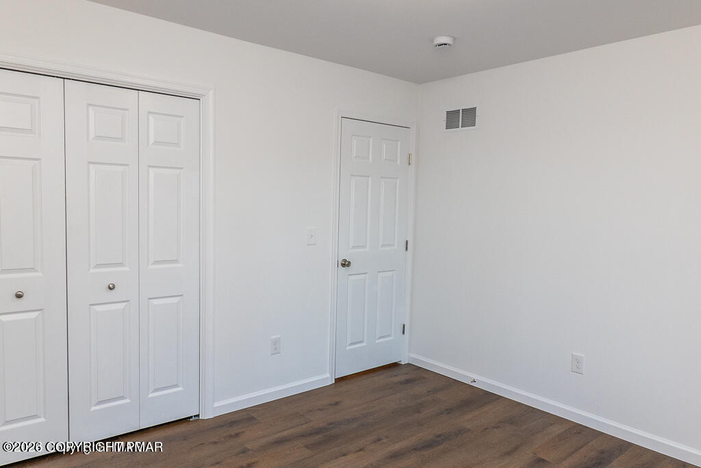 226 Apache Drive Effort, PA 18330 - Photo 24 of 30 a view of an empty room with wooden floor