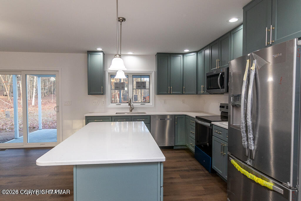 226 Apache Drive Effort, PA 18330 - Photo 6 of 30 a kitchen with stainless steel appliances a refrigerator sink and stove