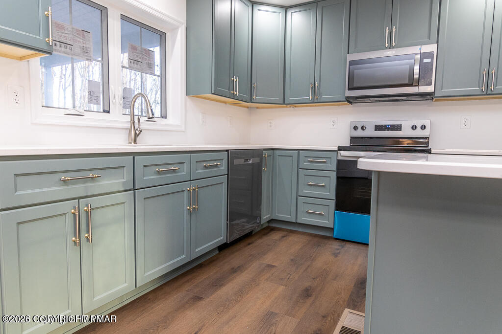 226 Apache Drive Effort, PA 18330 - Photo 8 of 30 a kitchen with cabinets stainless steel appliances and a sink