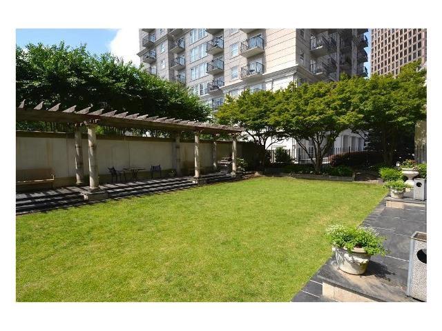 199 14th Street Northeast, Unit 510 Atlanta, GA 30309 - Photo 17 of 21 a view of a backyard with sitting area