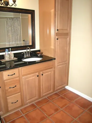 a bathroom with a sink and a mirror