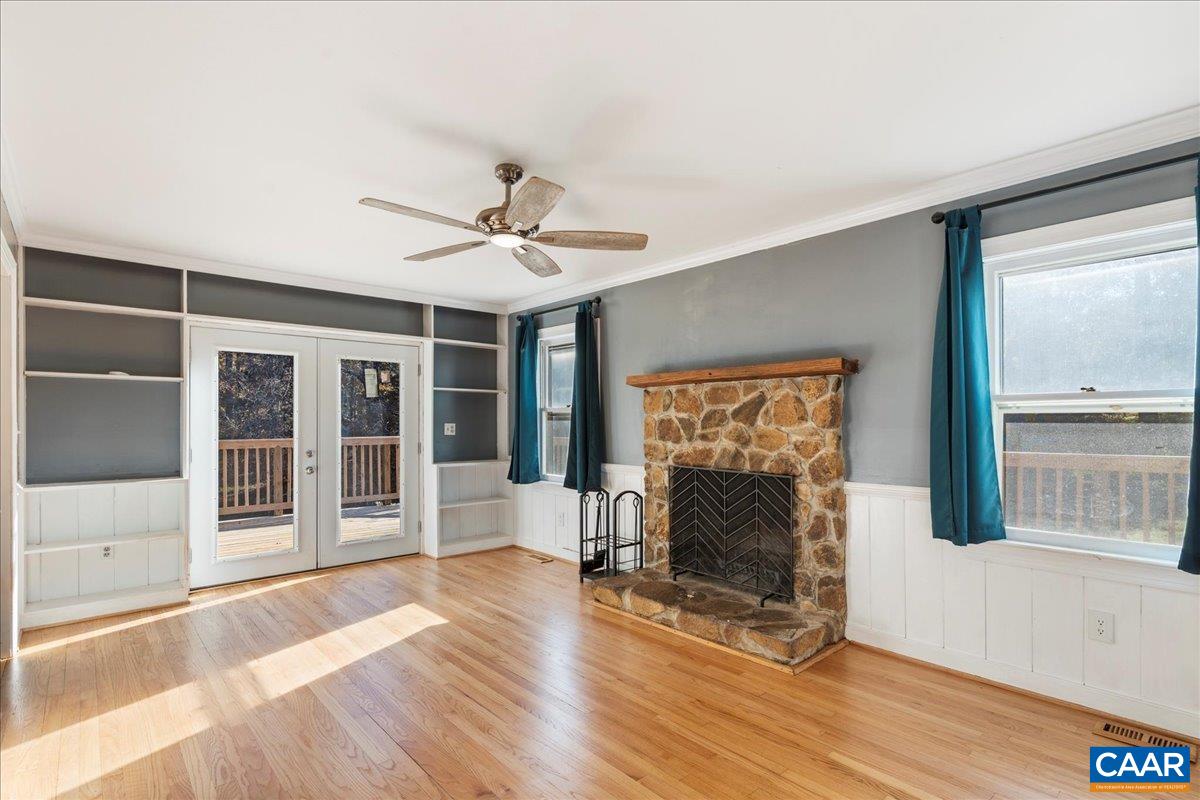 555 Gillums Ridge Road Charlottesville, VA 22903 - Photo 15 of 66 a living room with furniture and a fireplace